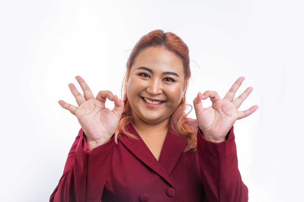 Free Image of Asian business woman show ok sign with fingers 