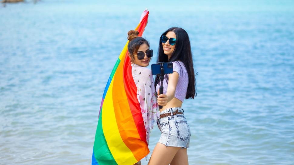 Free Image of LGBT Lesbian couple love and happiness concept - women on the beach 
