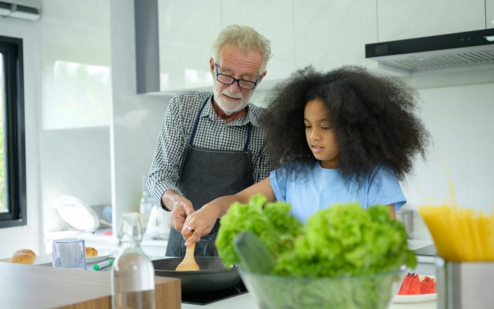 Free Image of Grandfather and grandchildren cooking together, mixed family 