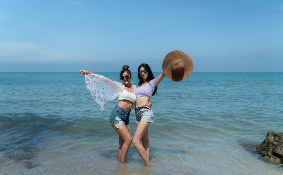 Free Image of LGBT couple travels to the beach 