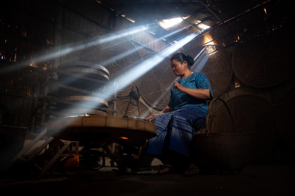 Free Image of Silkworms spun into threads by village women 