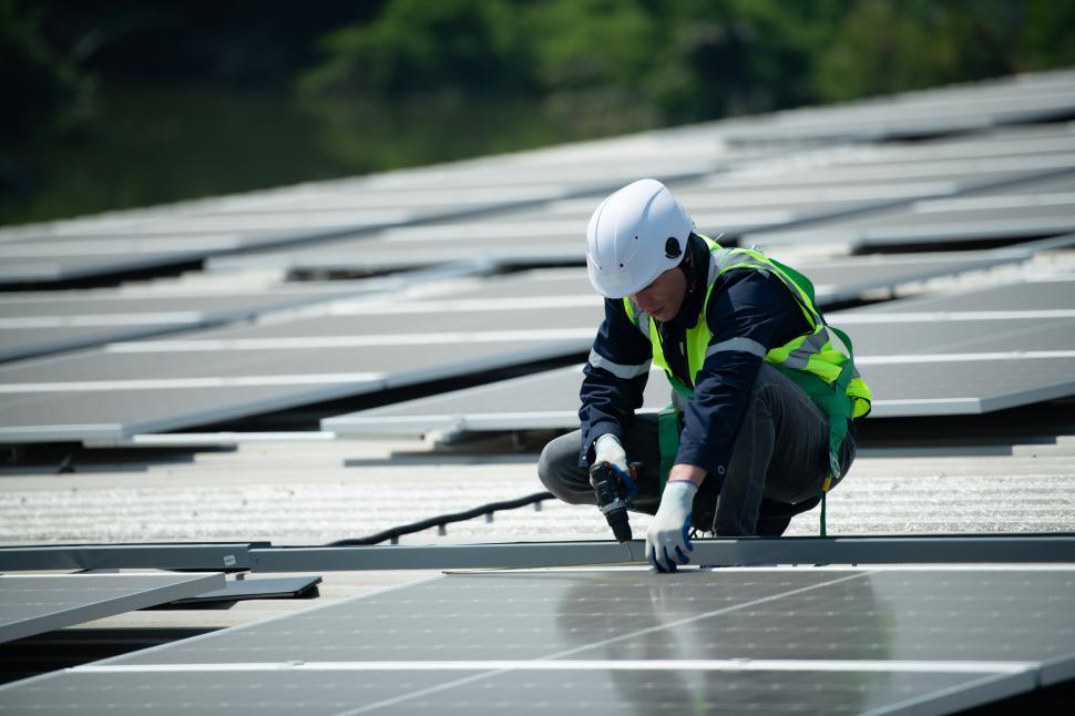 Free Image of Installing solar panels on commercial building 