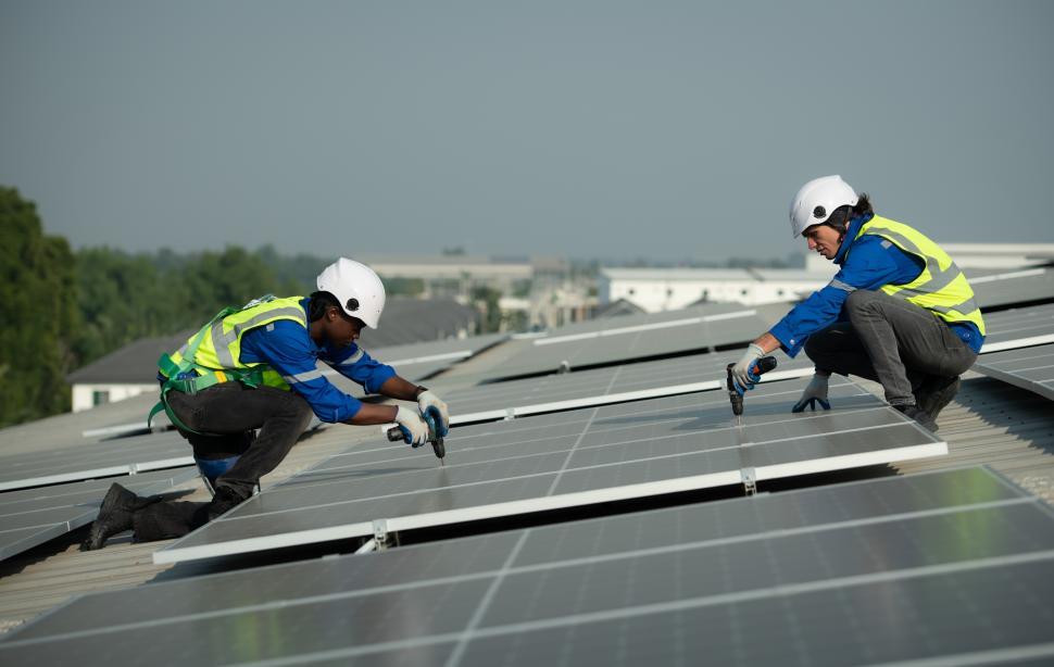 Free Image of Technicians installing rooftop solar array 