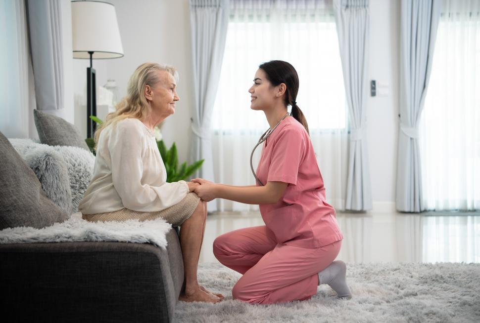 Free Image of Caregiver working with an elderly woman at an in home visit 