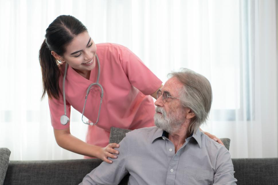 Free Image of Caregiver visiting an elderly man at weekly check in 