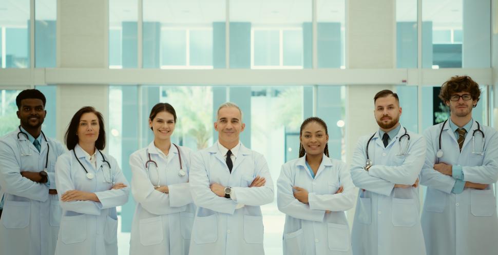 Free Image of Portrait of Doctors and medical students standing with arms crossed 