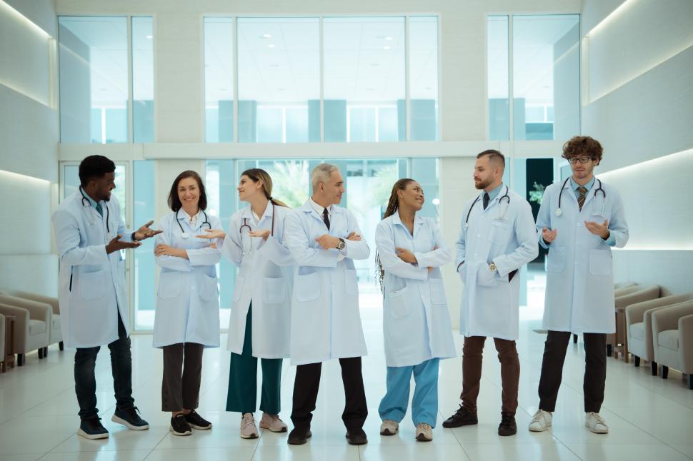 Free Image of Group of Doctors and medical students standing together, relaxed 