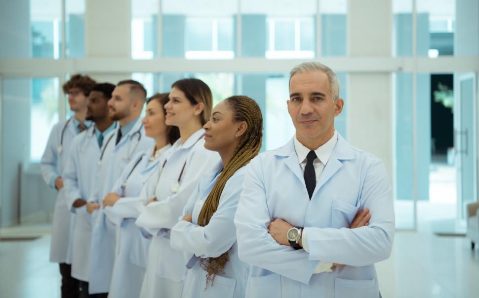 Free Image of Doctors and medical students in a line in the background 