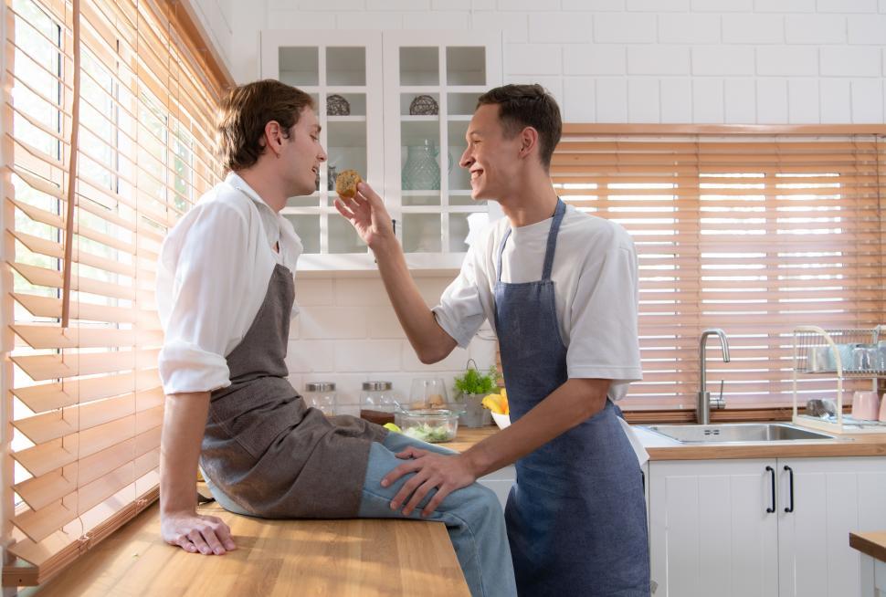 Free Image of Young couple enjoy cooking food together in the kitchen 