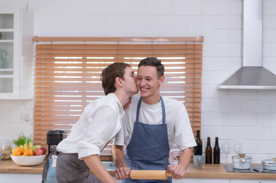Free Image of Affectionate young couple enjoy cooking together in the kitchen 
