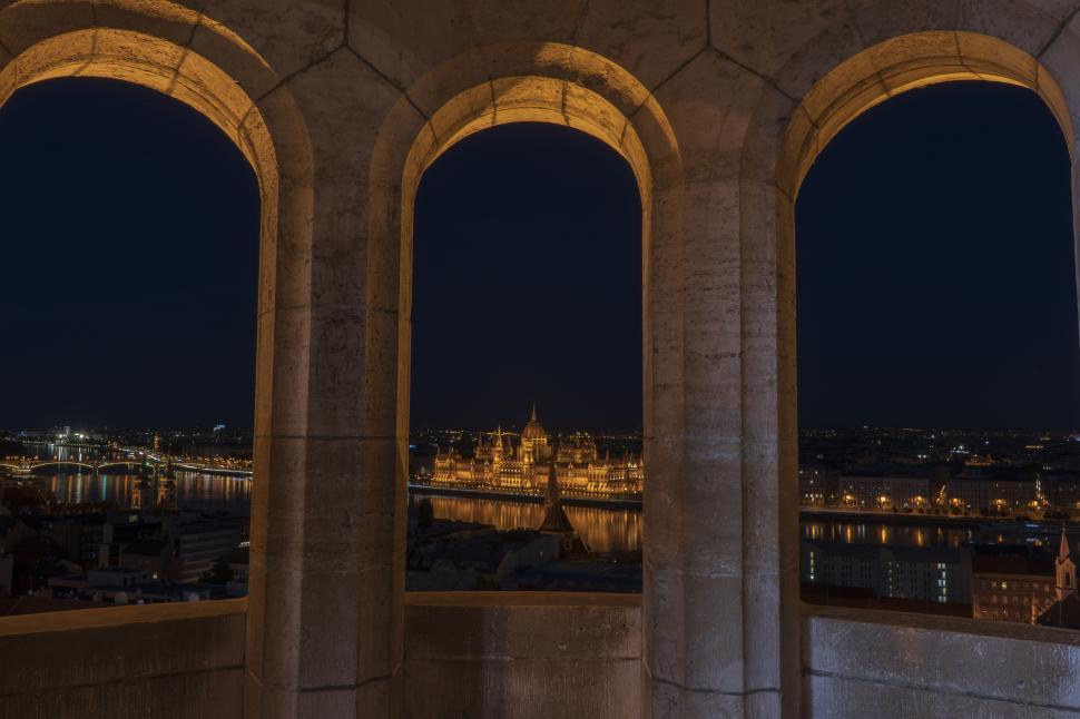 Free Image of A Glimpse of a City at Night Through a Window 