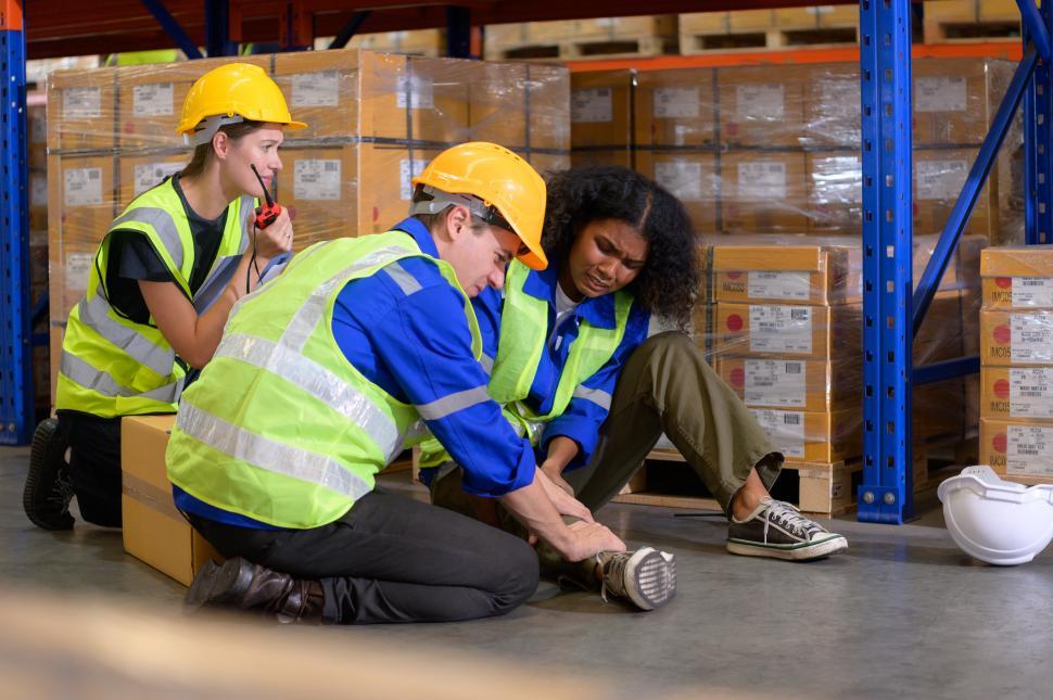 Free Image of Worker has been injured on the warehouse floor 