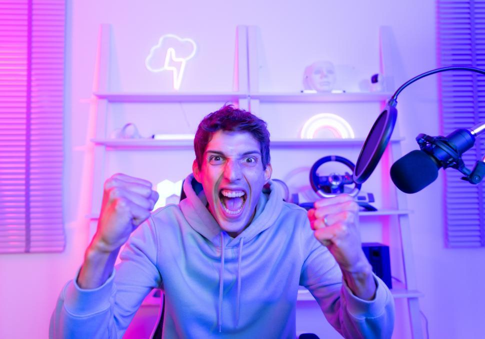Free Image of The winning mood of a professional gamer or streamer in the studio 