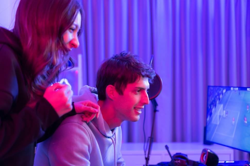 Free Image of Two gamers playing intense games in modern studio 