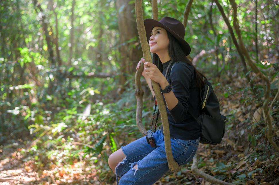 Free Image of Young woman trekking and enjoying quiet time in the woods 