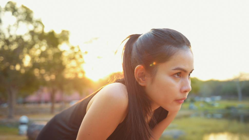 Free Image of Young woman resting during outdoor exercise activity 