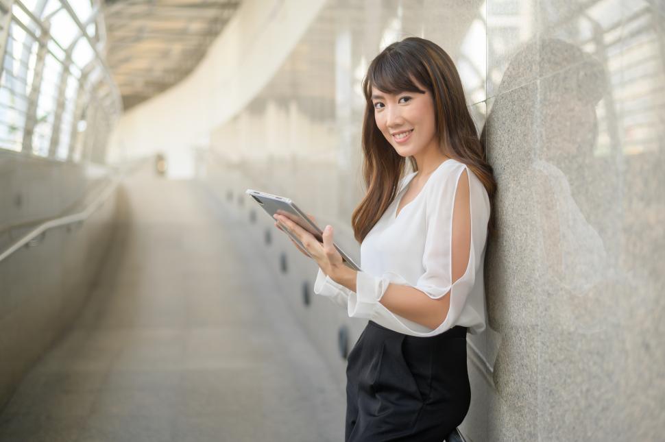 Free Image of Portrait of young businesswoman is working in modern city 