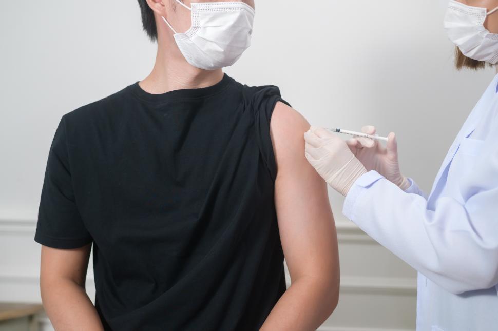 Free Image of Female doctor injecting vaccine to patient arm 