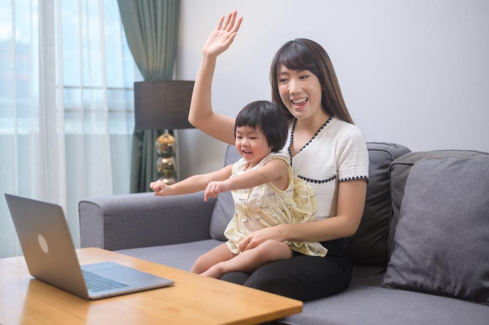 Free Image of Happy mom and daughter talking on a video chat call 