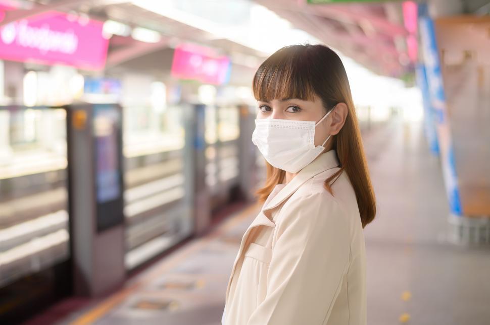 Free Image of Young woman is wearing protective mask in metro, public transportation protection 