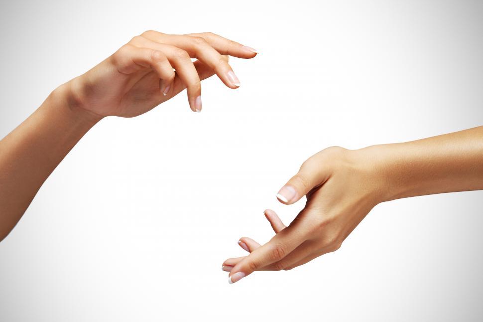 Free Image of Pair of elegant hands facing each other on white background 