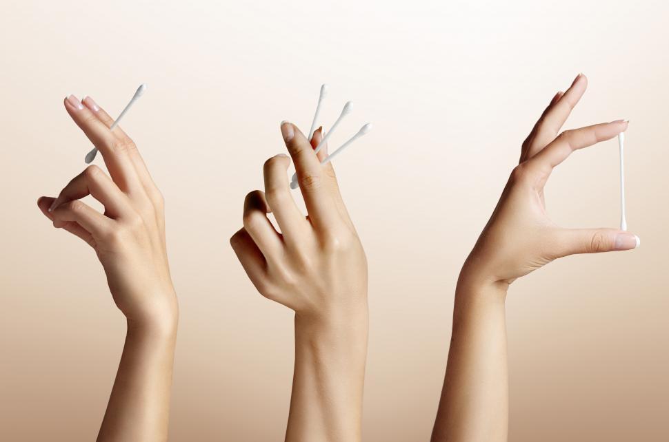 Free Image of Manicured hands holding cotton swabs in various ways 