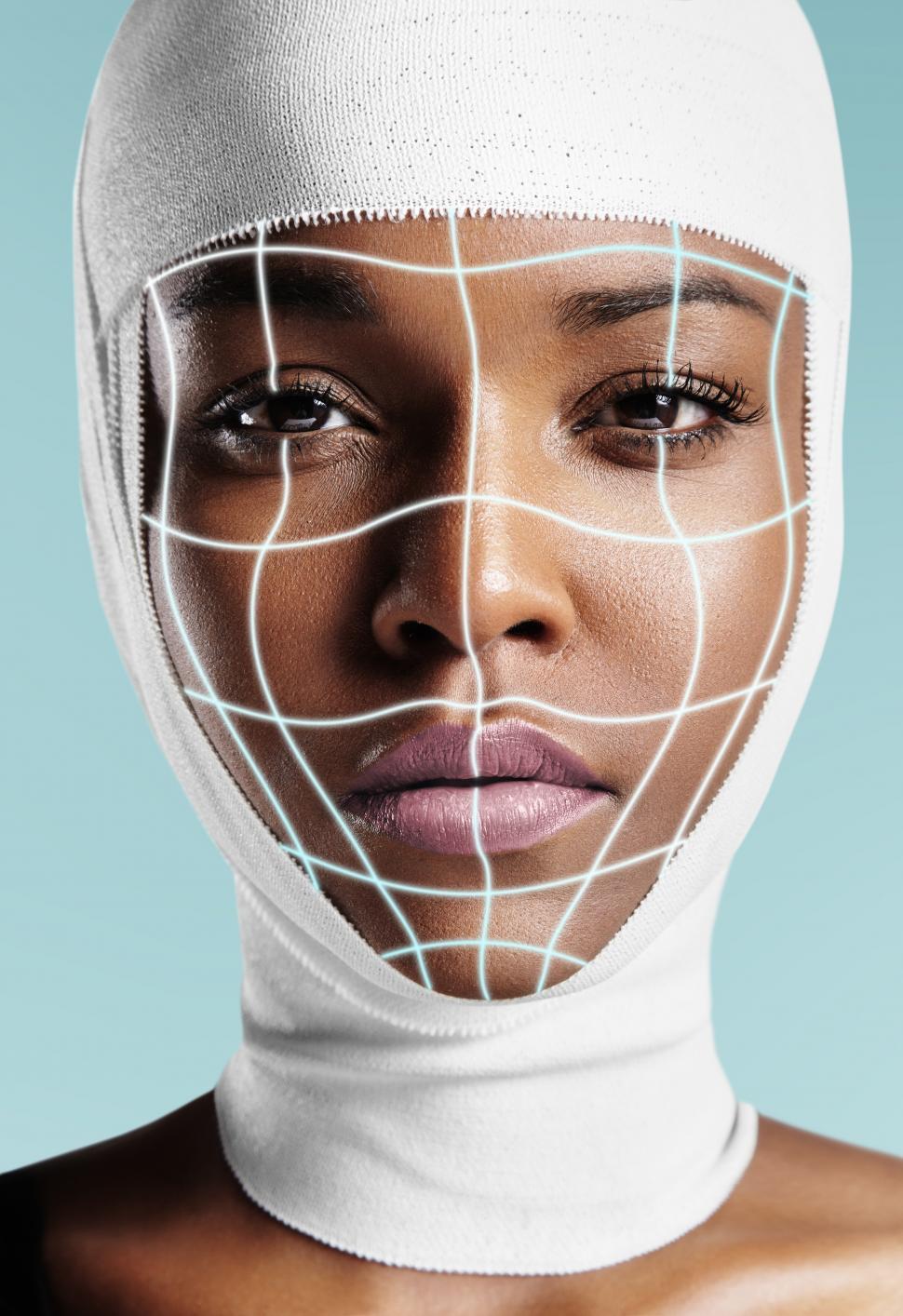 Free Image of black woman with bandaged head and glowing surgery lines 