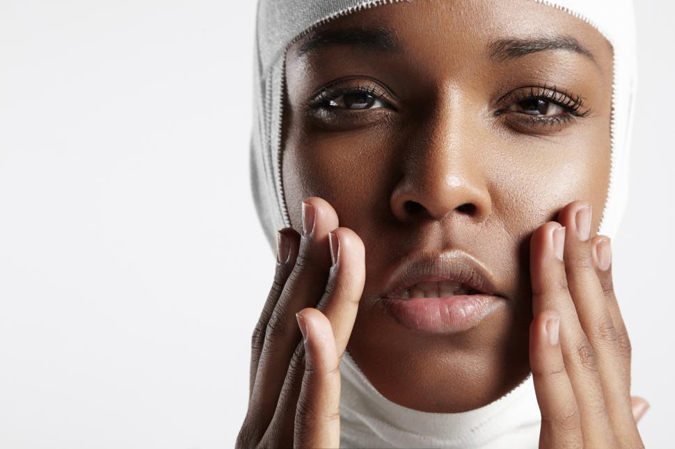 Free Image of black woman with bandaged head and tender face from cosmetic procedure 