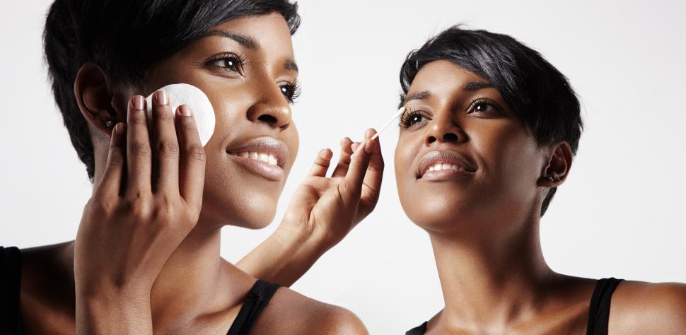 Free Image of black skin cleansing - two views of the same woman with different products 