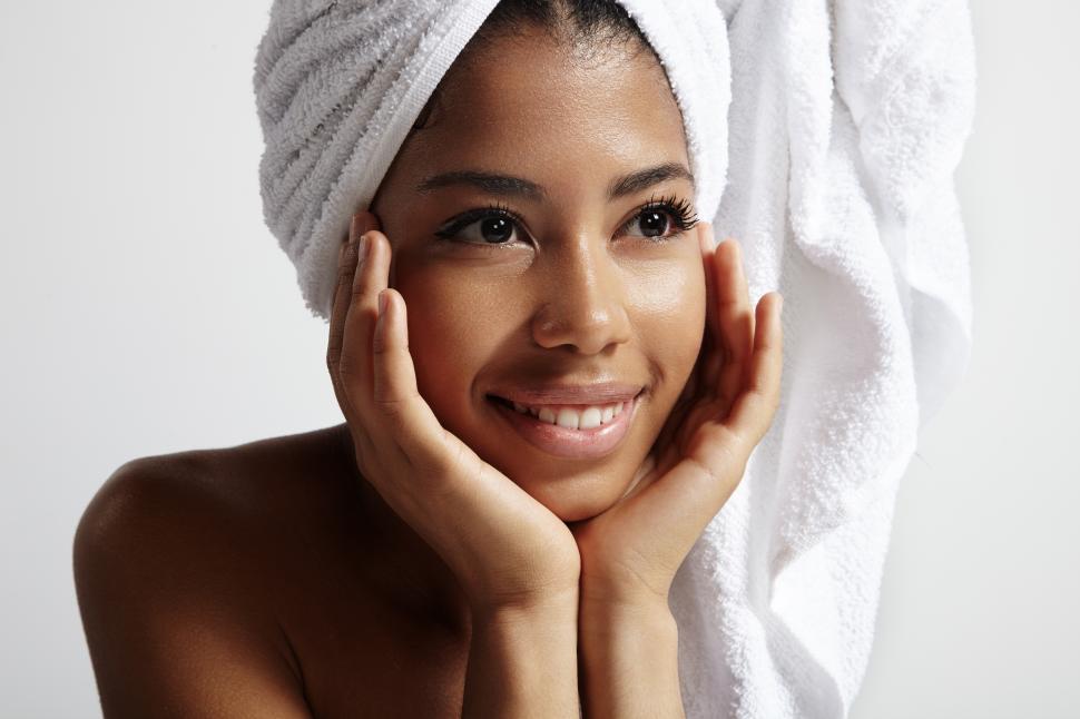 Free Image of beautiful young black woman with a towel on her head and wet skin 