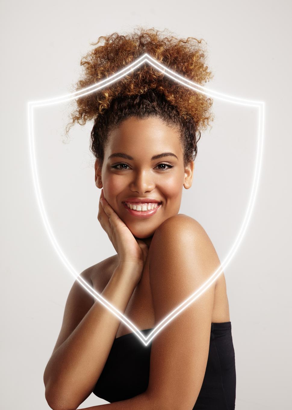 Free Image of happy woman behind the shield illustration, protecting skin from damage 
