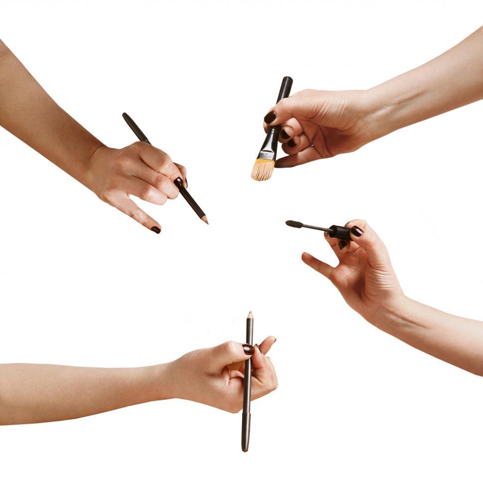 Free Image of hands with a makeup brushes and pencils, isolated on white 