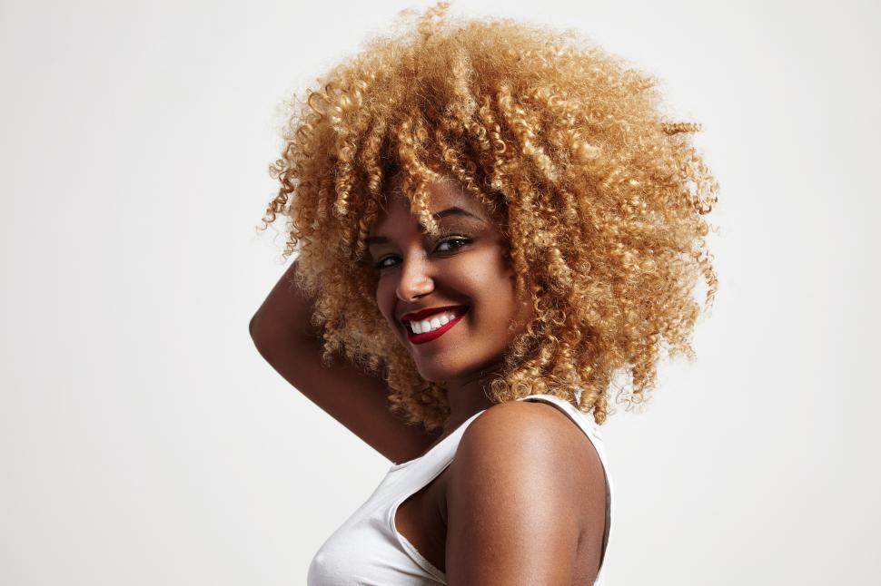 Free Image of blondy afro hair woman with big smile 