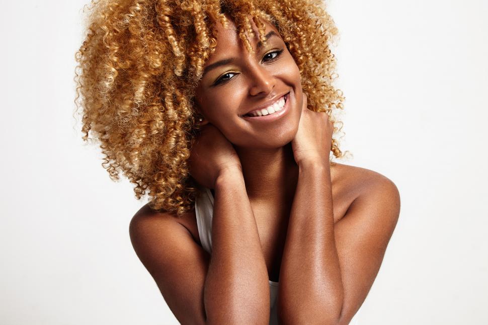 Free Image of young black woman with blonde curly hair 