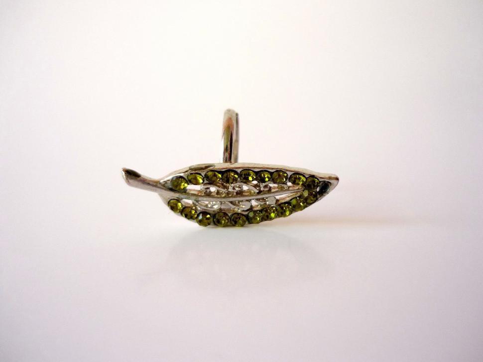 Free Image of Silver Brooch With Black Diamonds on White Background 