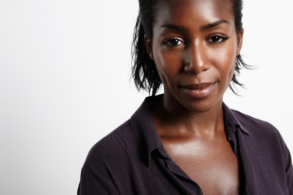 Free Image of black woman with neutral expression looking at the camera 