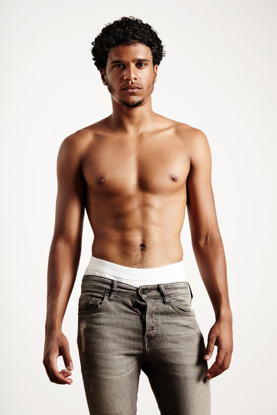 Free Image of young man wearing jeans, showing fit body. shirtless 