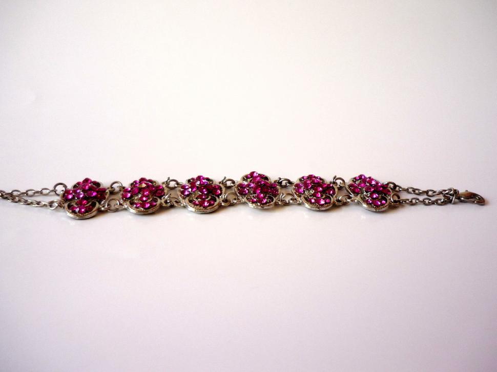 Free Image of Elegant Silver Bracelet With Pink Stones 