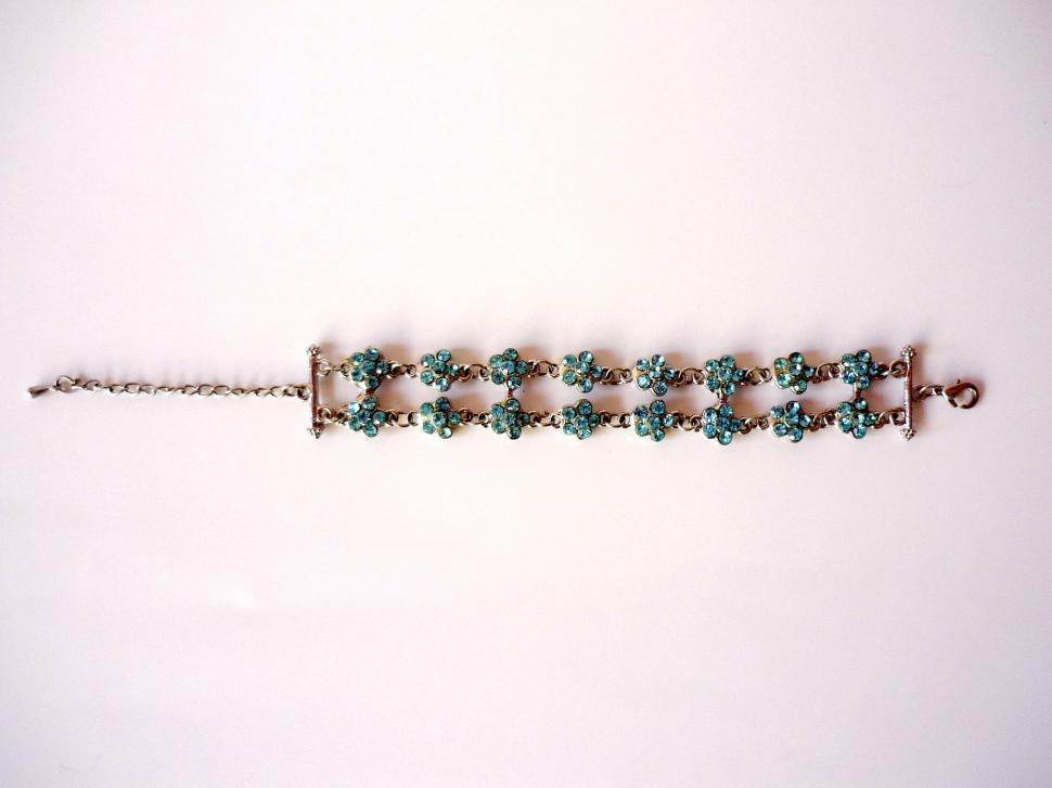 Free Image of Bracelet With Green Beads on White Background 