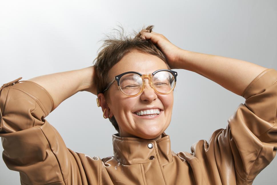 Free Image of happy caucasian woman with short hair, laughing 