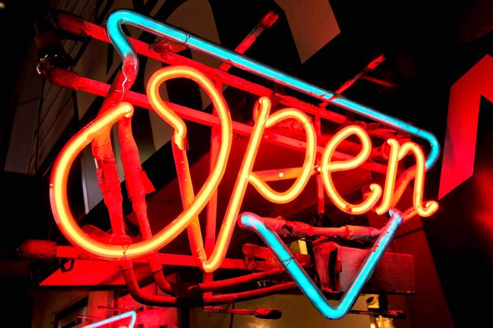 Free Image of A neon sign with arrow and arrow 