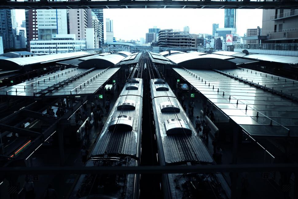 Free Image of A train station with many trains 