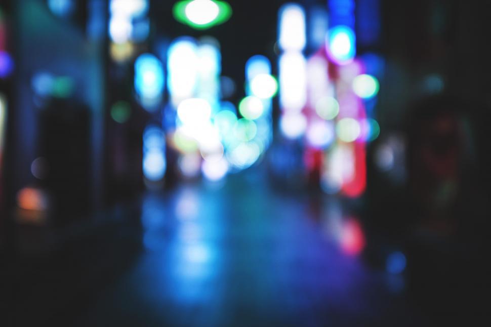 Free Image of A blurry image of a street with lights 