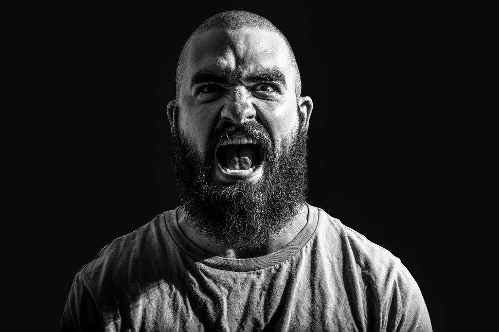 Free Image of Photo of a bearded man screaming 