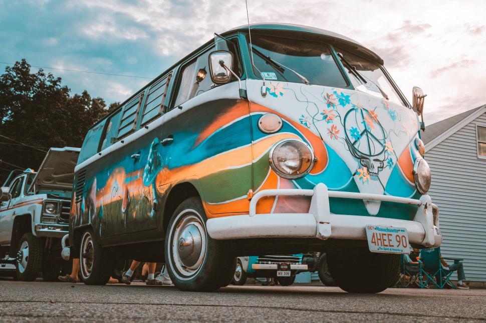 Free Image of Photo of a colorful VW bus with a peace sign painted on the side 