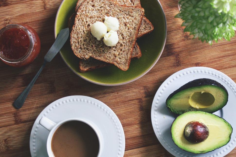 Free Image of A plate of toast with butter and avocado on it 
