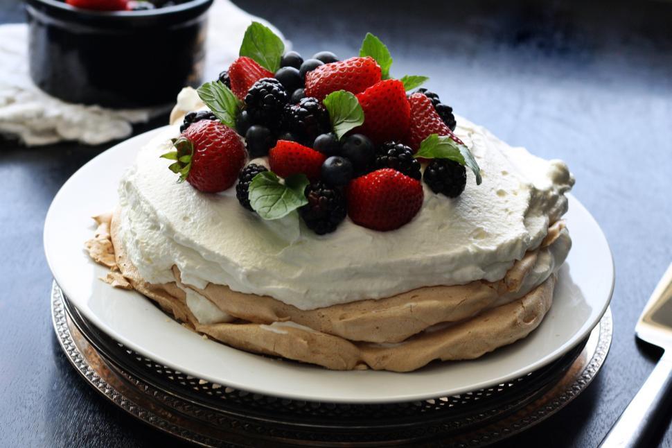 Free Image of A dessert with whipped cream and strawberries 