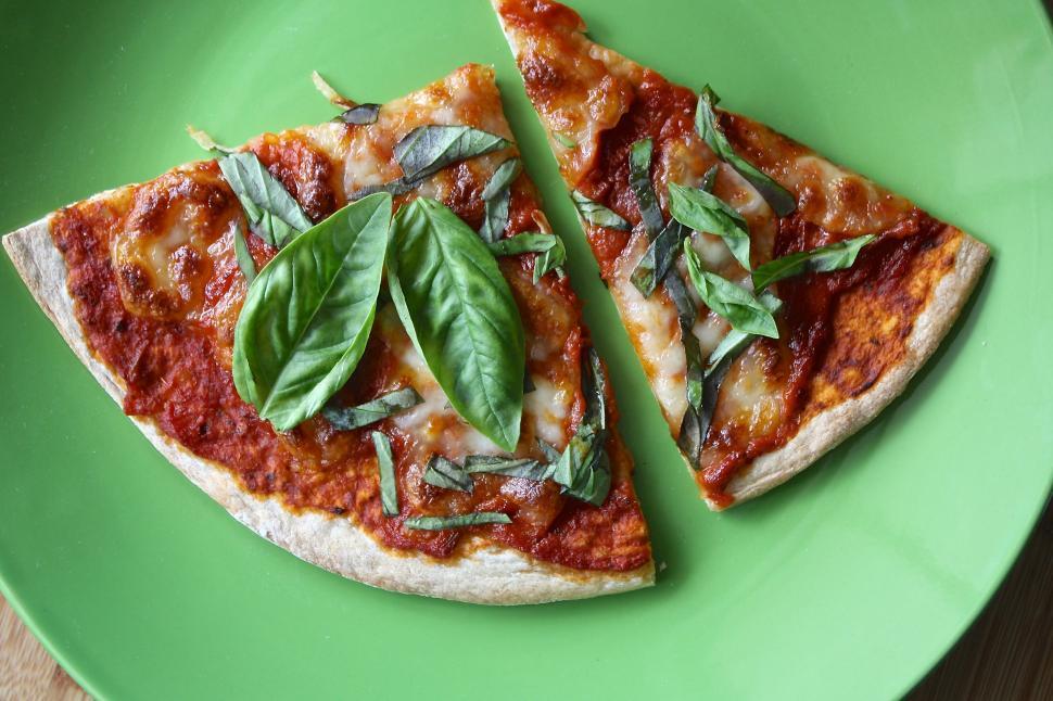 Free Image of A pizza with basil on top 