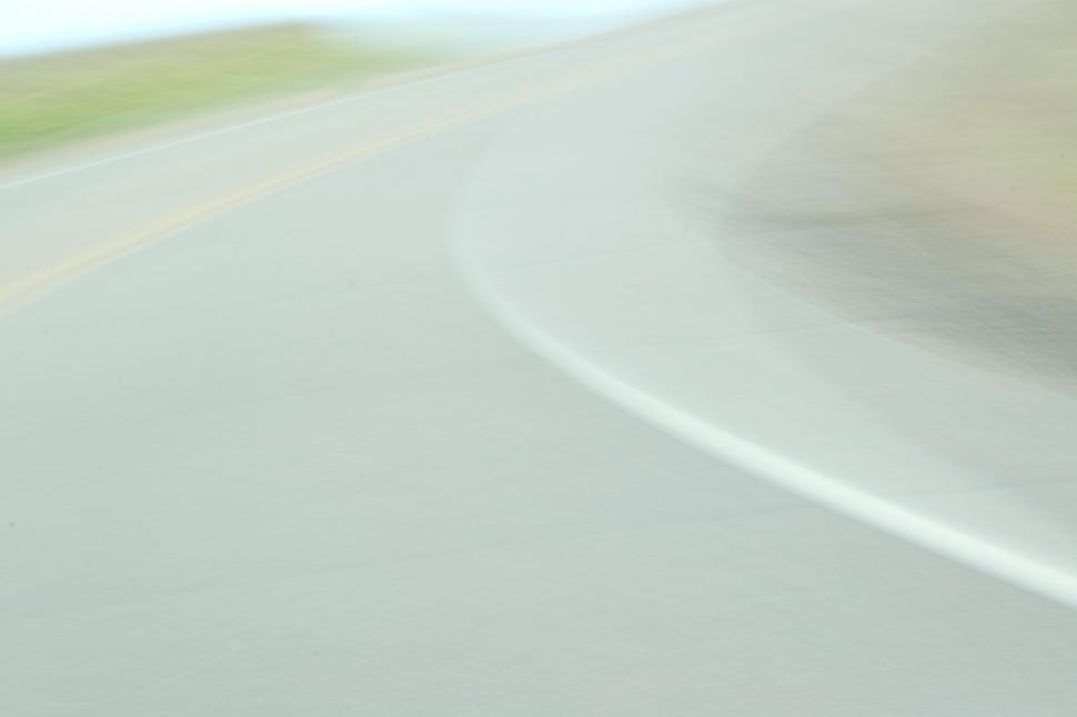 Free Image of Blurry Photo of a Person Riding a Motorcycle 