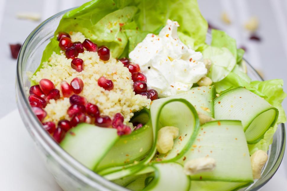 Free Image of Fresh Salad With Cucumbers, Lettuce, and Pomegranate 